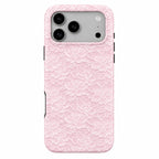 Phone case with pink lace pattern on a white background